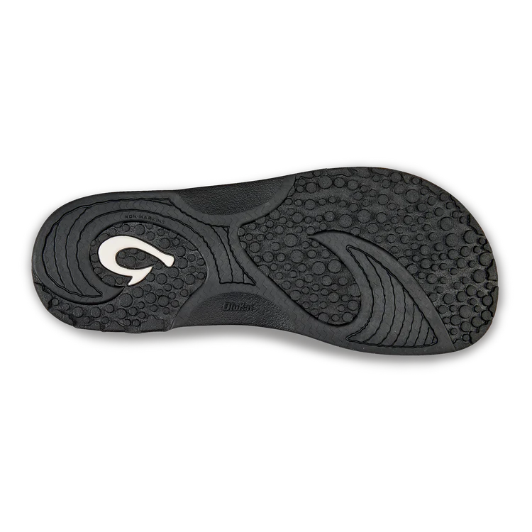 Black Olukai Men's Nalu Slide sandal with a strap on a white background