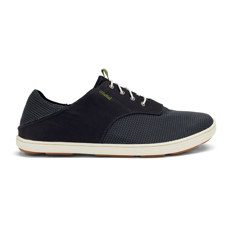 A black Olukai Men's Nohea Moku shoe on a white background