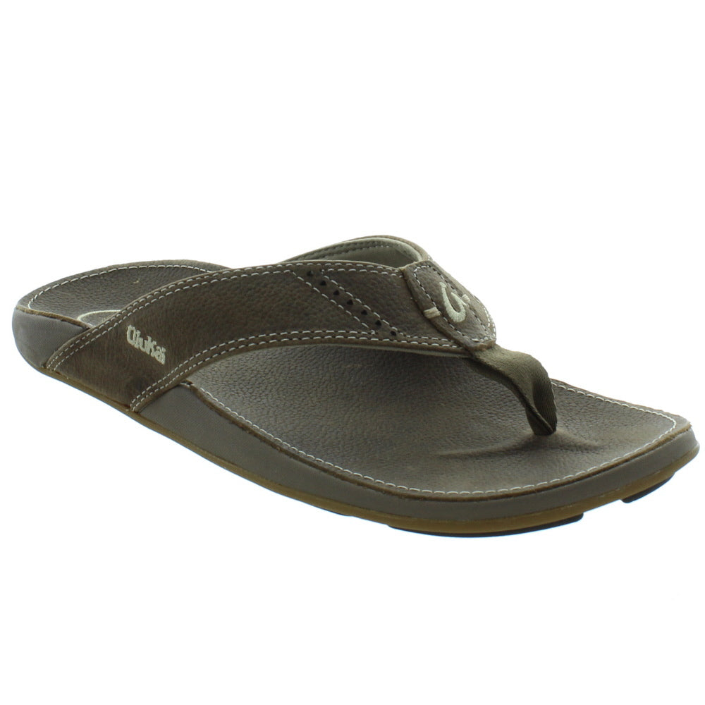 A brown Olukai Mens Nui Sandal on a white background