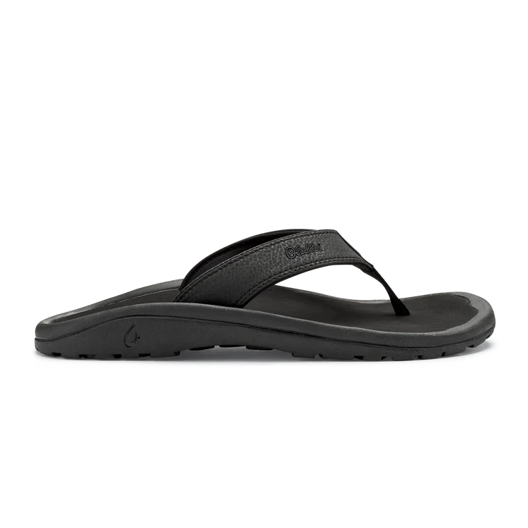 Black Olukai Men's Ohana flip-flop sandal with an Olukai logo on a white background