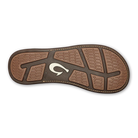 A brown leather Olukai Men's Tuahine flip-flop sandal on a white background