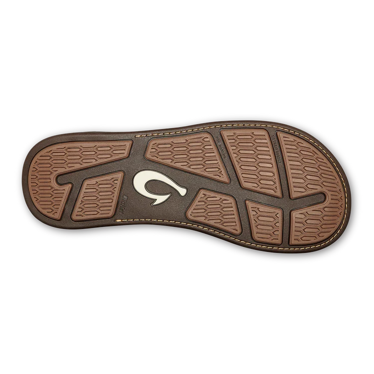 A brown leather Olukai Men's Tuahine flip-flop sandal on a white background
