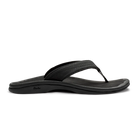 A black Olukai Women's Ohana flip-flop sandal on a white background