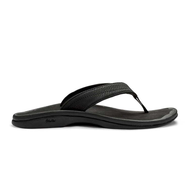 A black Olukai Women's Ohana flip-flop sandal on a white background