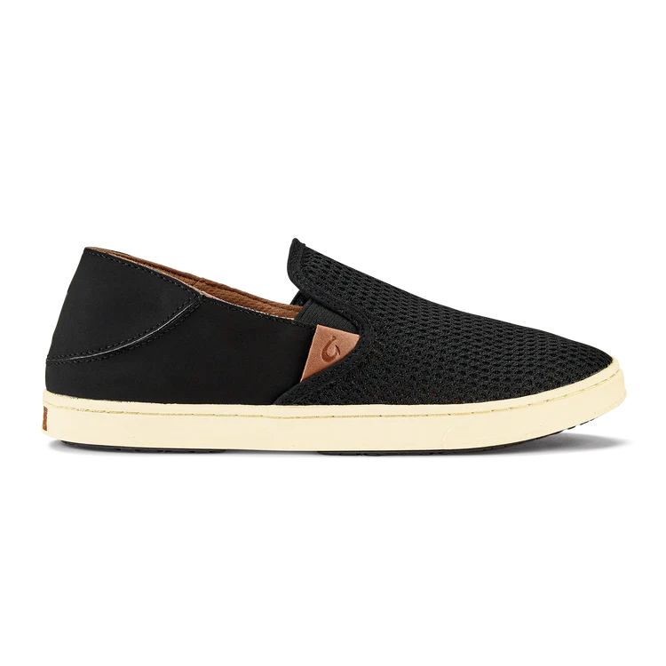 Black Olukai Women's Pehuea slip-on shoe that features a collapsible heel with a white sole on a white background