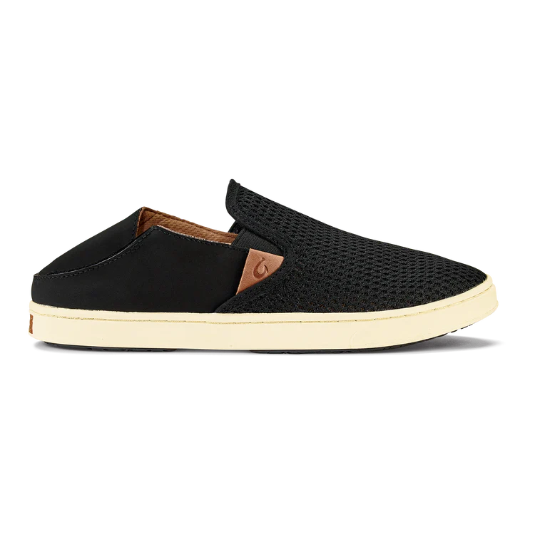 Black Olukai Women's Pehuea slip-on shoe that features a collapsible heel with a white sole on a white background