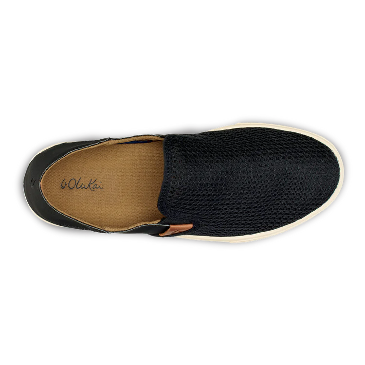 Black Olukai Women's Pehuea slip-on shoe that features a collapsible heel with a white sole on a white background