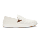 White Olukai Women's Pehuea slip-on shoe that features a collapsible heel with a white sole on a white background