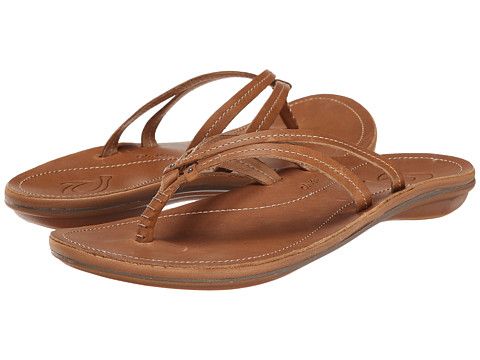 A pair of brown leather Olukai Women's U'i sandals on a white background
