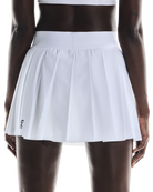On Women's Court Pleated Skirt featuring lightweight performance fabric, pleated styling, built-in shorts, and athletic comfort.