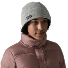 Front view of a birch white Patagonia Better Sweater Beanie featuring 100% recycled polyester sweater-knit fleece fabric, a doubled cuff design, and a low-profile construction.