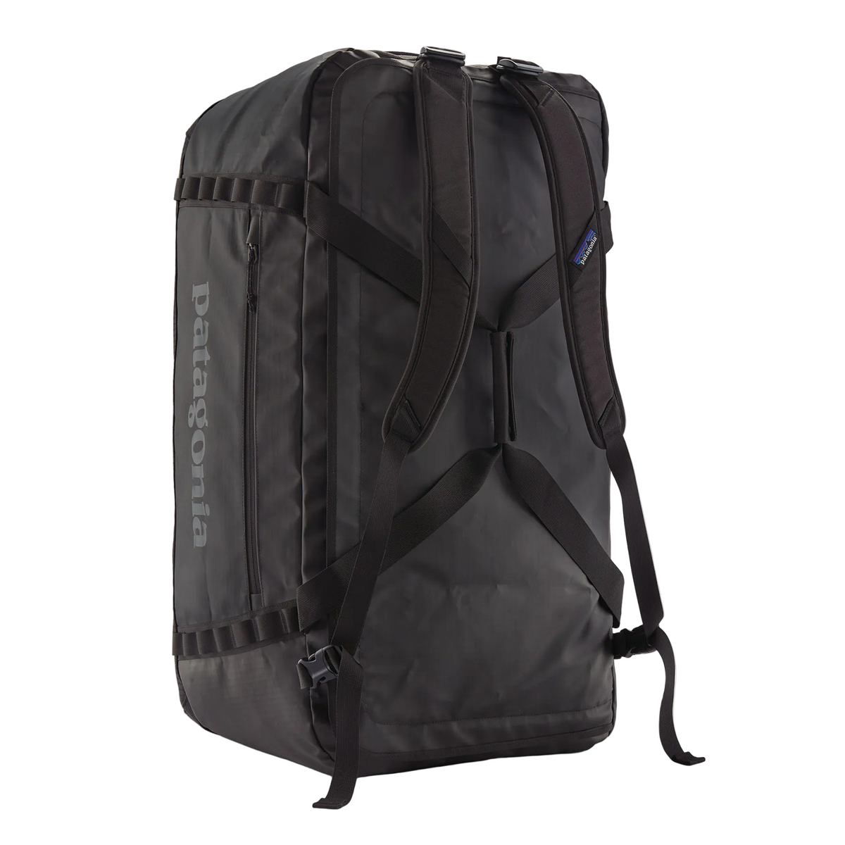 Rear view of the black on black Patagonia Black Hole Duffel 100L featuring weather-resistant TPU-laminated ripstop fabric, removable ergonomic backpack shoulder straps, reinforced end haul handles, a padded base, and heavy-duty exterior daisy chain lash loops.