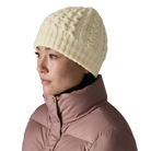 Front view of a birch white Patagonia Coastal Cable Beanie featuring a recycled wool blend cable-knit body, an interior recycled polyester fleece headband lining, and a low-profile fit.