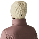 Rear view of a birch white Patagonia Coastal Cable Beanie featuring a recycled wool blend cable-knit body, an interior recycled polyester fleece headband lining, and a low-profile fit.