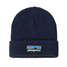 Front view of a navy blue Patagonia Junior Logo Beanie featuring a fine-gauge recycled polyester knit, a fold-over rib-knit cuff, and an embroidered front logo patch.