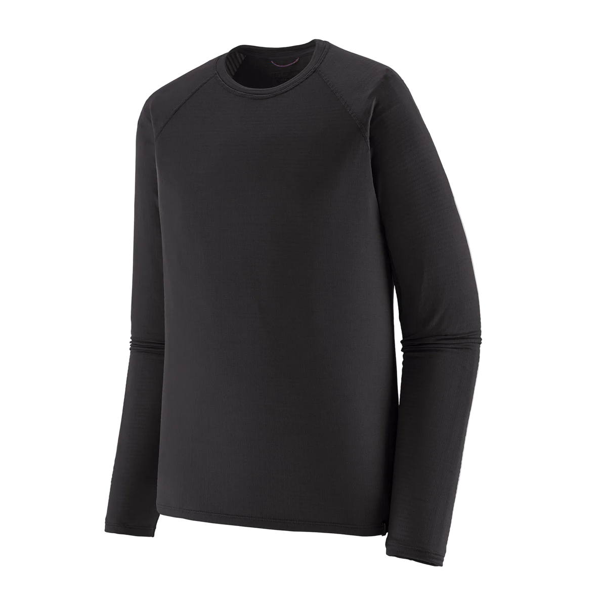 Front view of the black Patagonia Men's Capilene Thermal Weight Crew Baselayer featuring Polartec Power Grid fabric with an open-grid brushed interior, a self-fabric crewneck, offset shoulder seams, full underarm gussets, flatlock seam construction, elastic thumb loops, and a subtle drop-tail hem.