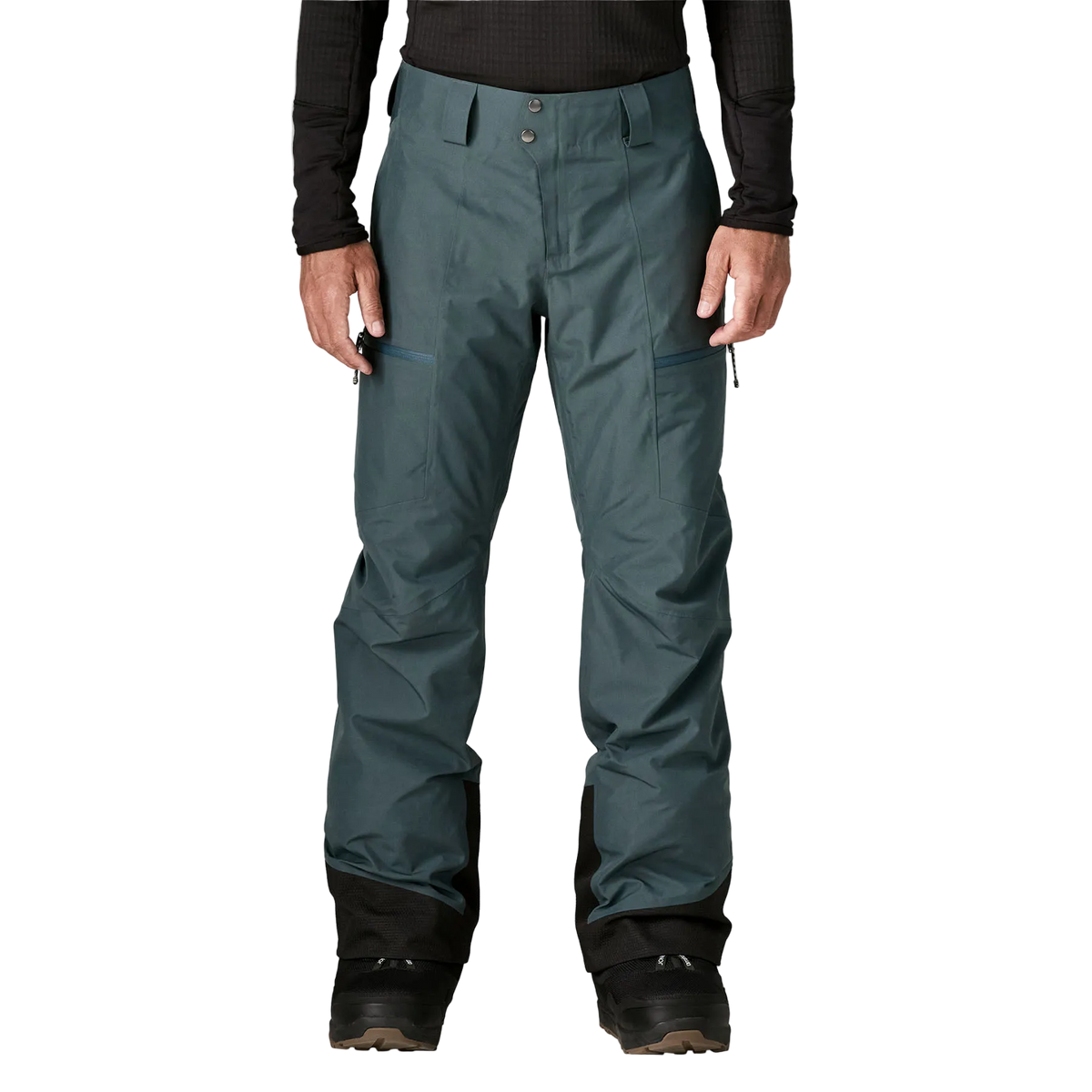 Front view of the Patagonia Men's Insulated Storm Shift Pants featuring a 2-layer GORE-TEX ePE fabric shell, 60g Thermogreen 100% recycled polyester insulation, an adjustable waist with dual-snap closure and belt loops, watertight zippered handwarmer and thigh pockets, mesh-lined thigh ventilation zips, articulated knees, inner ankle scuff guards, internal boot gaiters with gripper elastic, and an integrated RECCO reflector.
