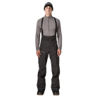 Front view of the Patagonia Men's PowSlayer Bib Pants featuring a 3-layer GORE-TEX Pro shell construction with a 100% recycled nylon face fabric, a low-profile bib with adjustable elastic suspenders, a full-coverage drop-seat configuration, watertight Vislon side ventilation zippers, dual thigh cargo pockets, a central chest pocket, inner ankle scuff guards, internal boot gaiters with gripper elastic, and a built-in RECCO reflector.