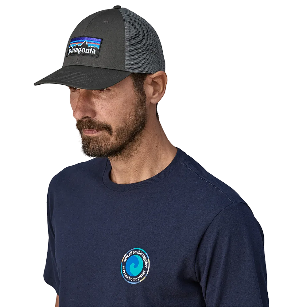 Front view of a forge grey Patagonia P-6 Logo LoPro Trucker Hat featuring an organic cotton canvas front crown, embroidered original artwork, NetPlus precurved brim, recycled polyester mesh back, and an adjustable rear snap closure.