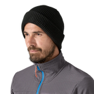 Front view of a black Patagonia SnowDrifter Beanie featuring a fine-gauge recycled polyester knit, low-profile helmet-compatible crown, and an interior microfleece headband lining.