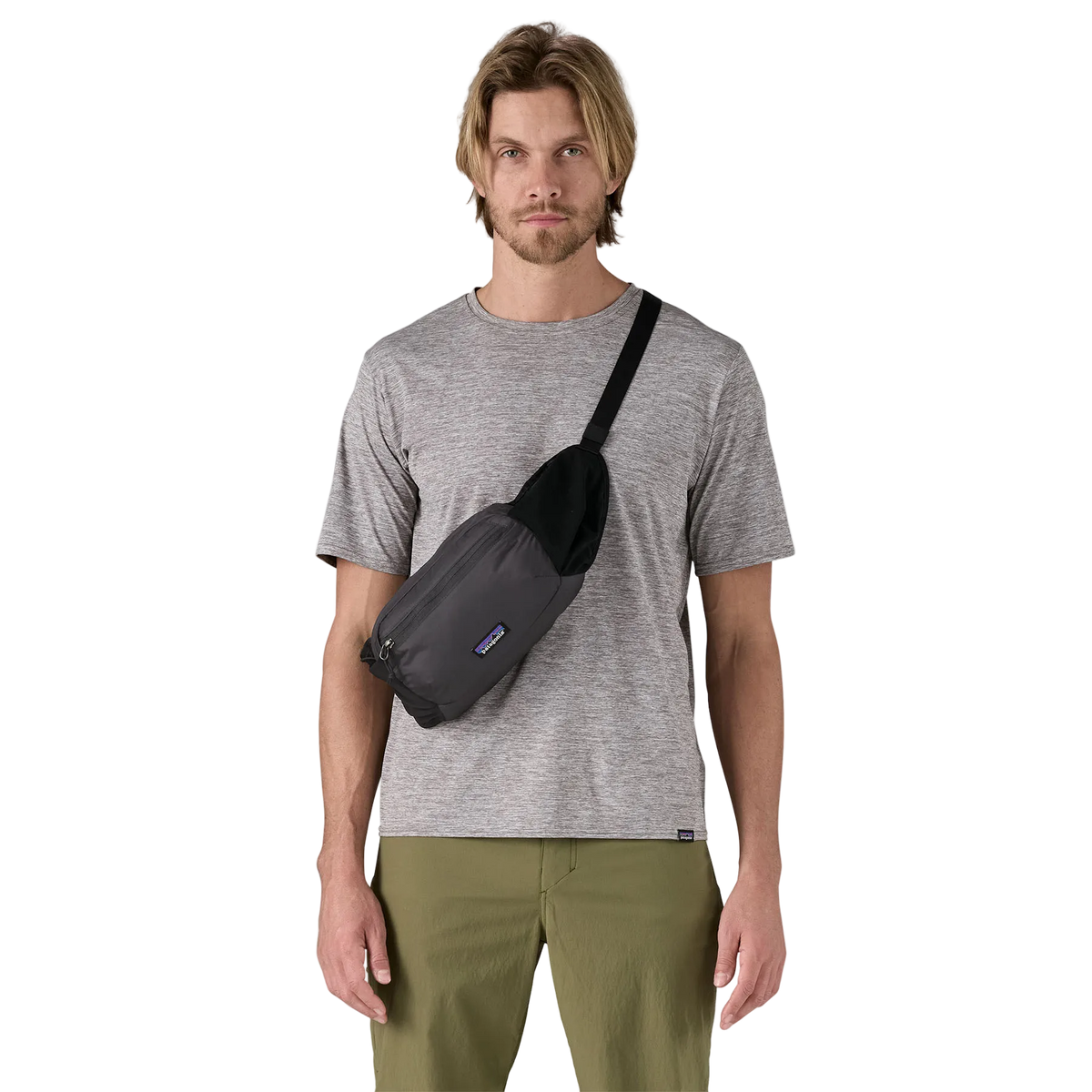 Front view of a black Patagonia Terravia Hip Pack featuring recycled nylon ripstop fabric, dual stretch-mesh water-bottle pockets, zippered main and front stash pockets, an airmesh back panel, and an adjustable webbed waist strap.
