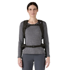 Front view of a black Patagonia Terravia Pack 22L featuring 100% recycled nylon ripstop fabric, breathable Regulator airmesh shoulder straps, a front quick-stash pocket, dual side stretch water-bottle pockets, and trekking pole attachment loops.