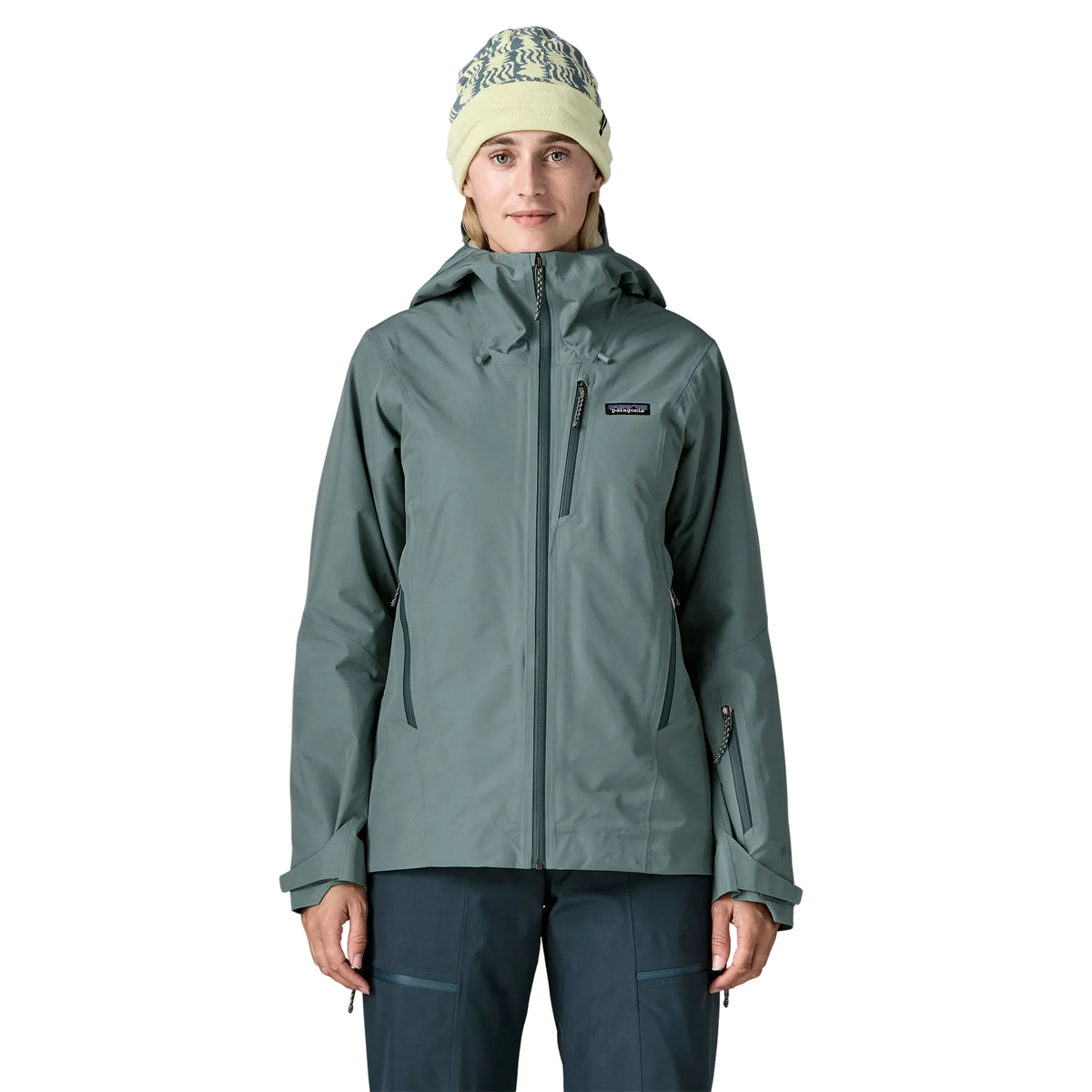 Front view of the Patagonia Women's Insulated Storm Shift Jacket featuring a 2-layer GORE-TEX shell, 60g Thermogreen 100% recycled polyester insulation, a two-way adjustable helmet-compatible hood with laminated visor, a watertight center-front zipper, underarm pit zips for ventilation, dual zippered handwarmer pockets, a zippered forearm pass pocket, an integrated powder skirt, and an embedded RECCO reflector.