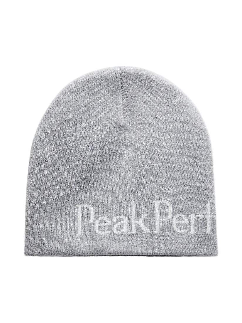 Front view of the Peak Performance Logo Hat featuring a soft double-layer knitted construction, fold-up cuff, stretch fit, and an embroidered front logo.