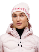 Front view of the Peak Performance Logo Hat featuring a soft double-layer knitted construction, fold-up cuff, stretch fit, and an embroidered front logo.