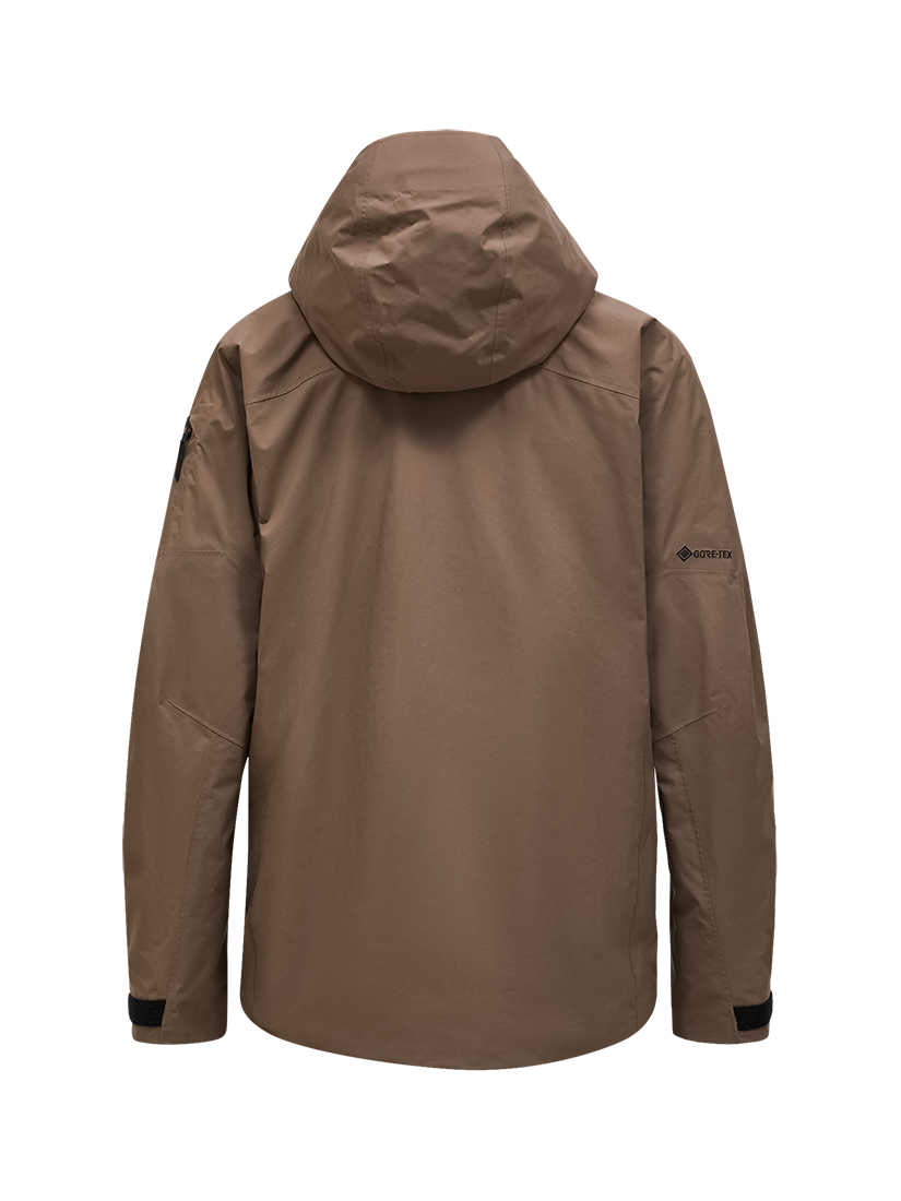 Rear view of a tan Peak Performance Men's Alpine GORE-TEX 2L Insulated Shell Jacket featuring a 2-layer GORE-TEX waterproof membrane, YKK AquaGuard storm zippers, a radio pocket, and a helmet-compatible hood.