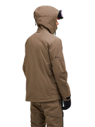 Rear view of a tan Peak Performance Men's Alpine GORE-TEX 2L Insulated Shell Jacket featuring a 2-layer GORE-TEX waterproof membrane, YKK AquaGuard storm zippers, a radio pocket, and a helmet-compatible hood.