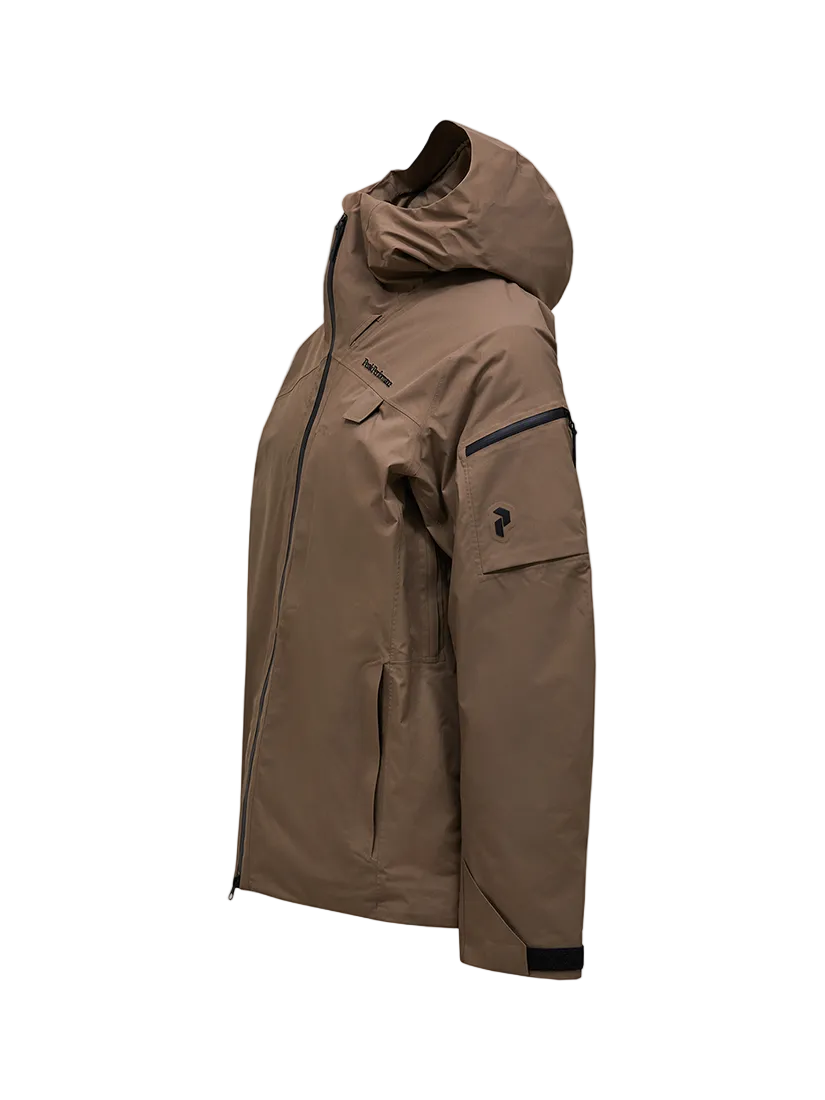 Side view of a tan Peak Performance Men's Alpine GORE-TEX 2L Insulated Shell Jacket featuring a 2-layer GORE-TEX waterproof membrane, YKK AquaGuard storm zippers, a radio pocket, and a helmet-compatible hood.