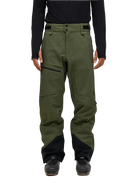 Front view of the pine needle green Peak Performance Men's GORE-TEX C-Knit 3L Shell Pants featuring 3-layer GORE-TEX fabric with C-KNIT backer technology, YKK AquaGuard leg ventilation zips, an adjustable velcro waistband, and reinforced Cordura lower leg scuff guards.