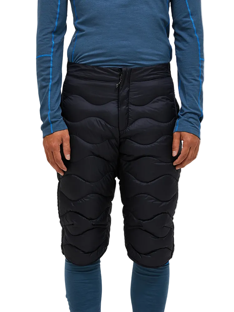 Front view of black Peak Performance Men's Helium Down Shorts featuring ultra-lightweight windproof fabric, signature wave quilting, 700-fill-power down insulation, and full-length side zips.