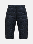 Peak Performance Men's Helium Down Ski Shorts featuring premium down insulation, full-length side zippers, wind-resistant fabric, and an athletic fit for winter performance.