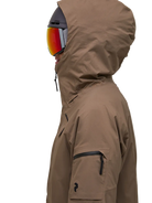 Side view of a brown Peak Performance Women's Alpine GORE-TEX 2L Insulated Shell Jacket featuring a 2-layer GORE-TEX waterproof shell, YKK AquaGuard storm zippers, an integrated radio pocket, and a helmet-compatible hood.