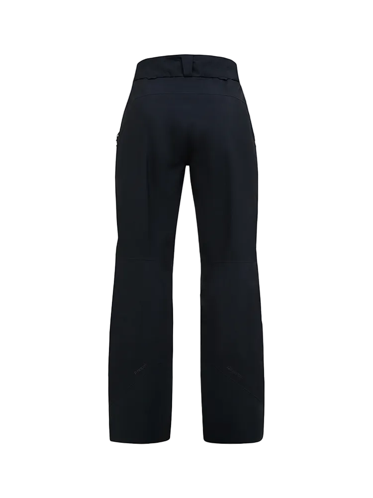 Rear view of a black Peak Performance Women's Alpine GORE-TEX 2L Insulated Shell Pants featuring a 2-layer GORE-TEX waterproof membrane, YKK AquaGuard zippered thigh vents, an adjustable waistband, and reinforced Cordura scuff guards.
