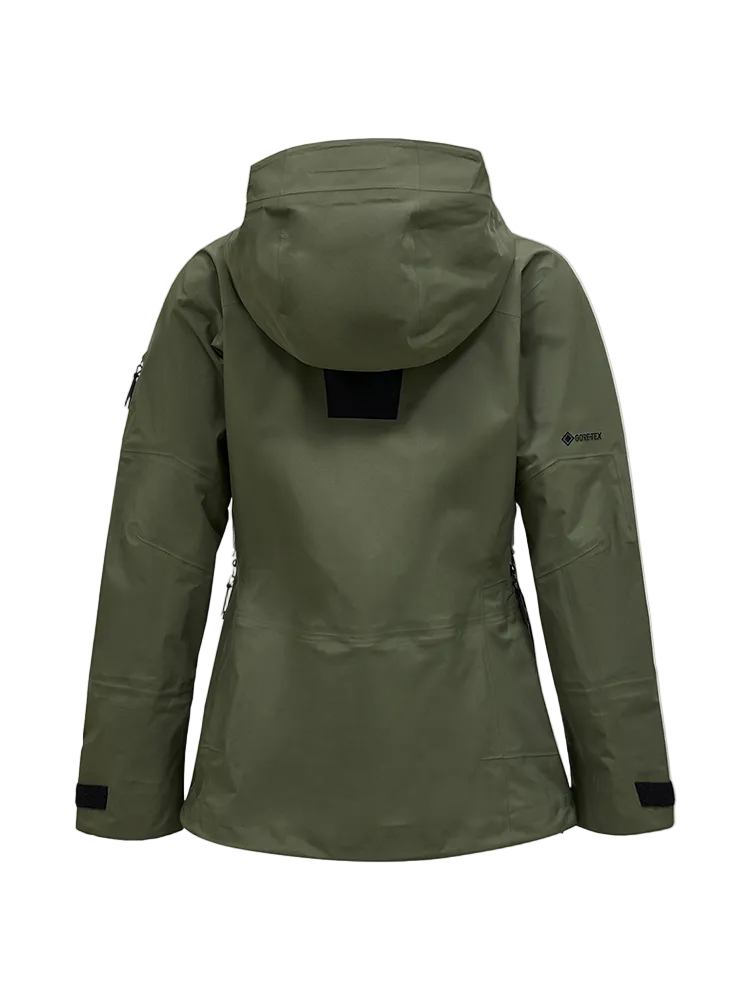 Rear view of a pine needle green Peak Performance Women's Alpine GORE-TEX C-Knit 3L Shell Jacket featuring 3-layer GORE-TEX fabric with C-KNIT backer technology, YKK AquaGuard zippers, a 2-way adjustable helmet-compatible hood, and two-way underarm pit zips.