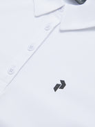 Peak Performance Women's Alta Golf Polo featuring lightweight performance fabric, breathable comfort, and a flattering athletic fit.