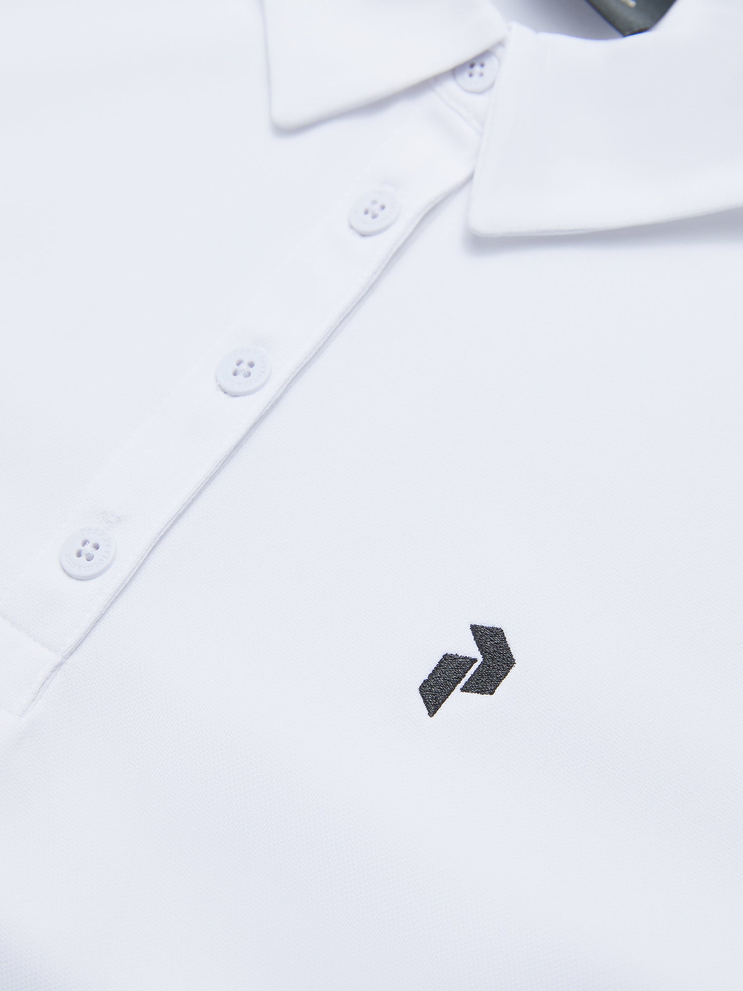 Peak Performance Women's Alta Golf Polo featuring lightweight performance fabric, breathable comfort, and a flattering athletic fit.