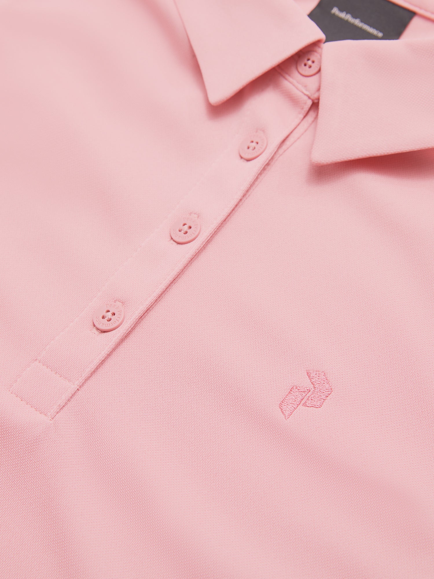 Peak Performance Women's Alta Golf Polo featuring lightweight performance fabric, breathable comfort, and a flattering athletic fit.