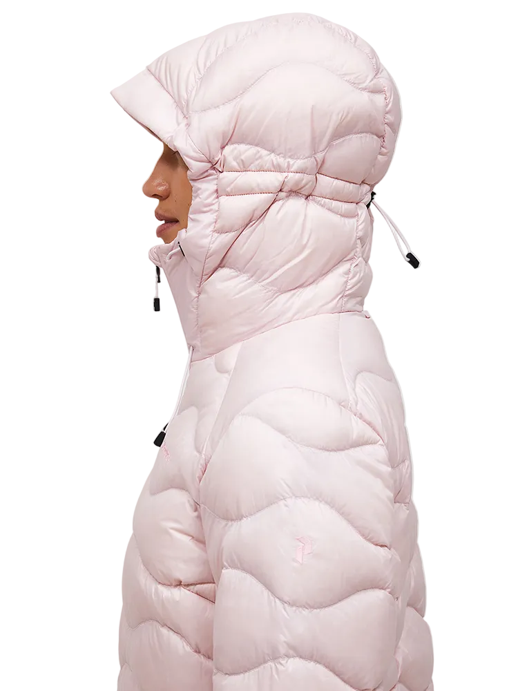 Side view of a frosted blossom pink Peak Performance Women's Helium Down Hooded Jacket featuring ultra-lightweight windproof fabric, signature wave quilting, 700-fill-power down insulation, and an elasticated fixed hood