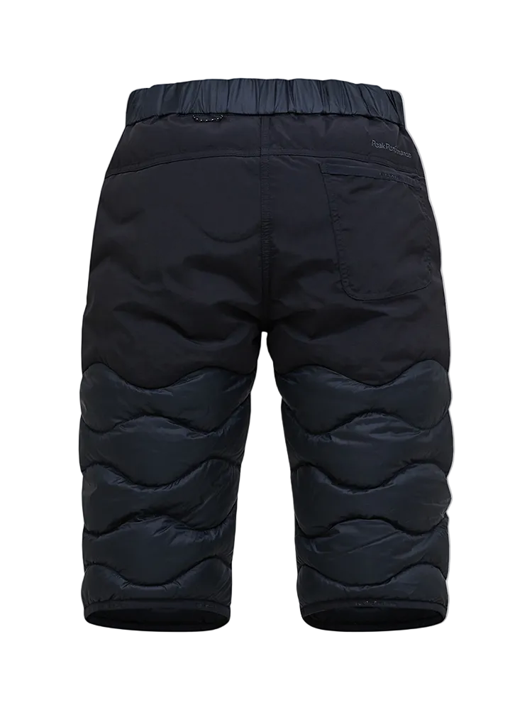 Rear view of black Peak Performance Women's Helium Down Shorts featuring ultra-lightweight windproof fabric, signature wave quilting, 700-fill-power down insulation, and a low-profile elastic waistband.