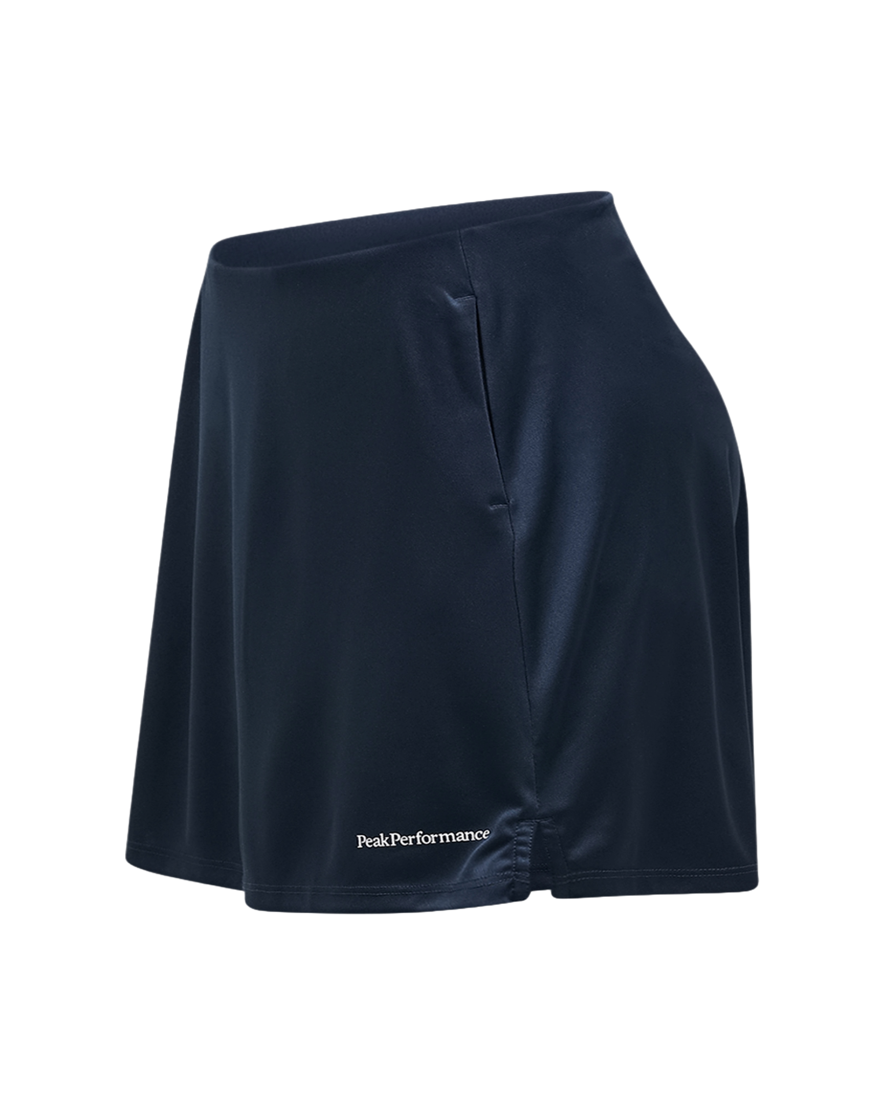 Peak Performance Women's Player Golf Skirt featuring lightweight stretch fabric, built-in shorts, and a flattering athletic fit.