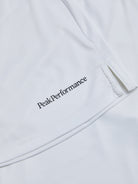Peak Performance Women's Player Golf Skirt featuring lightweight stretch fabric, built-in shorts, and a flattering athletic fit.