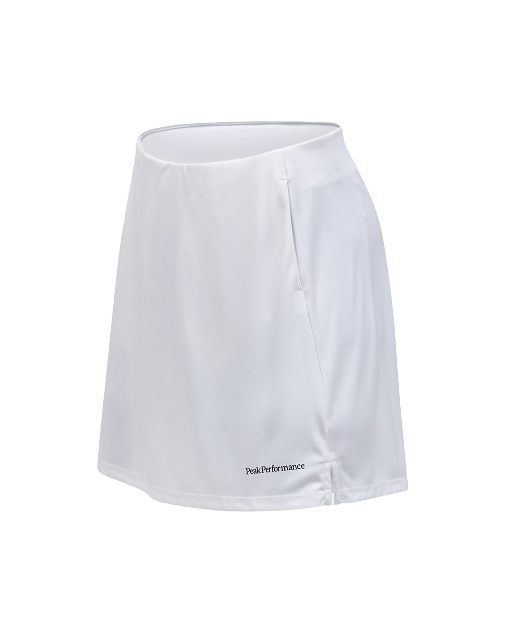 Peak Performance Women's Player Golf Skirt featuring lightweight stretch fabric, built-in shorts, and a flattering athletic fit.