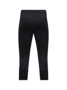 Rear view of black Peak Performance Women's Rider Essentials 3/4 Midlayer Pants featuring 4-way stretch technical fleece, a boot-compatible 3/4 leg length, flatlock seams, and a low-profile elastic waistband.