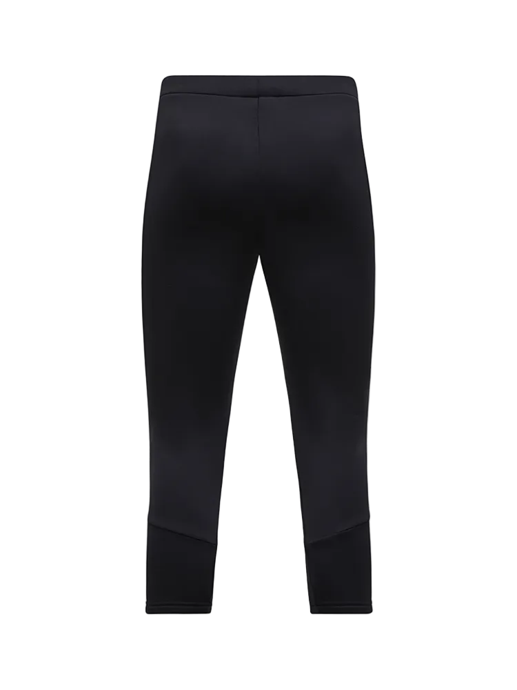 Rear view of black Peak Performance Women's Rider Essentials 3/4 Midlayer Pants featuring 4-way stretch technical fleece, a boot-compatible 3/4 leg length, flatlock seams, and a low-profile elastic waistband.