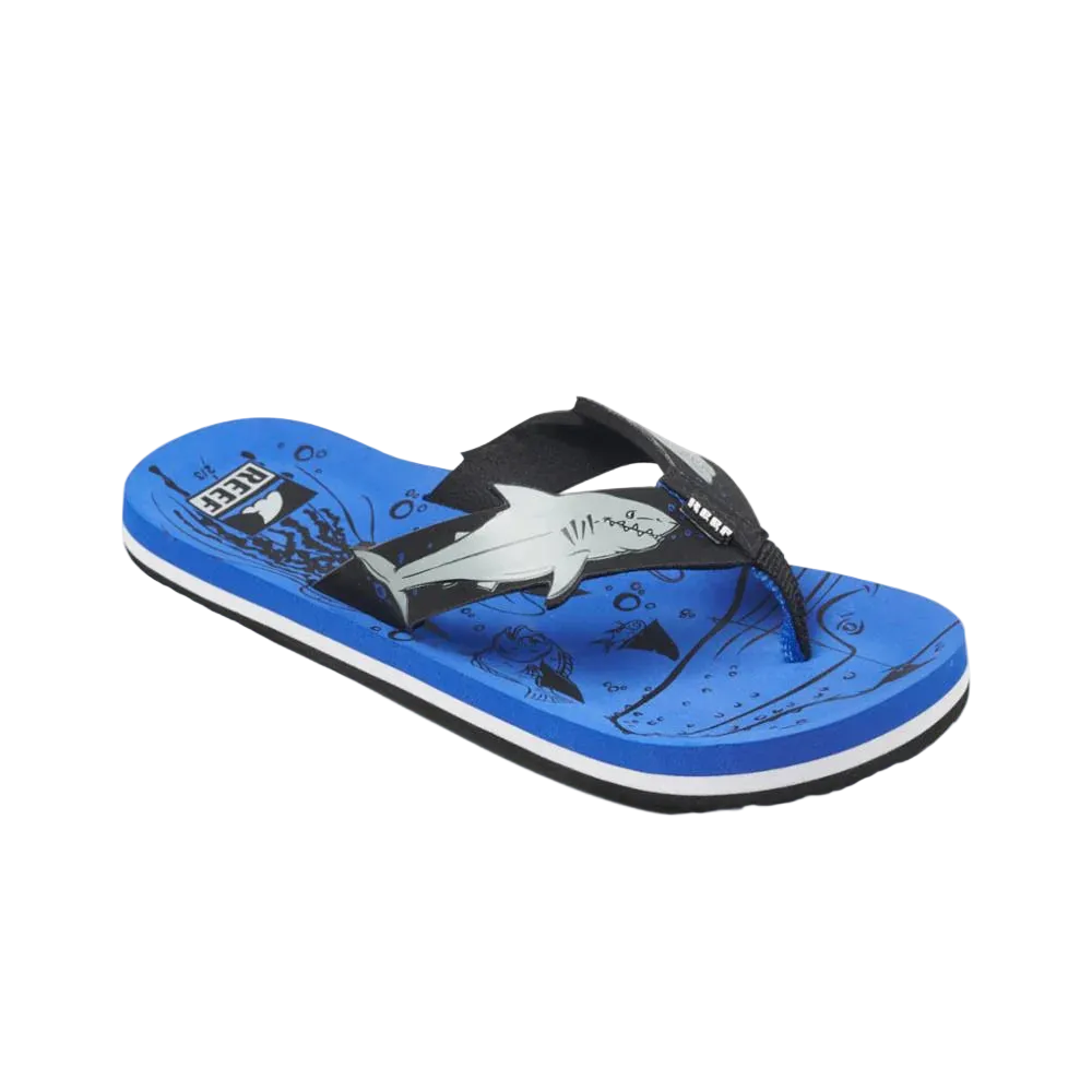 A blue Reef Junior Ahi Blue Shark flip-flop with shark design and Reef logo on a white background