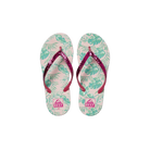 Pair of Reef Junior Stargazer Paradise flip-flops with pink straps and tropical leaf pattern on a white background